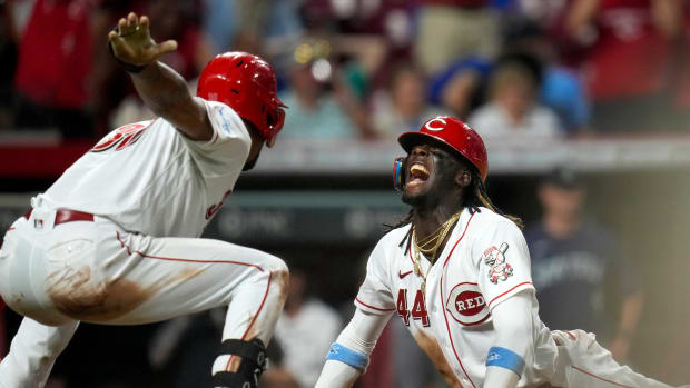 Cincinnati Reds shortstop Elly De La Cruz (44) scores from from second base for the winning run on a single off the bat of first baseman Christian Encarnacion-Strand (33) in the ninth inning of the MLB interleague between the Cincinnati Reds and the Seattle Mariners at Great American Ball Park in downtown Cincinnati on Tuesday, Sept. 5, 2023. The Reds won 7-6 on a walk-off single by Christian Encarnacion-Strand, scoring Elly De La Cruz from second base.  